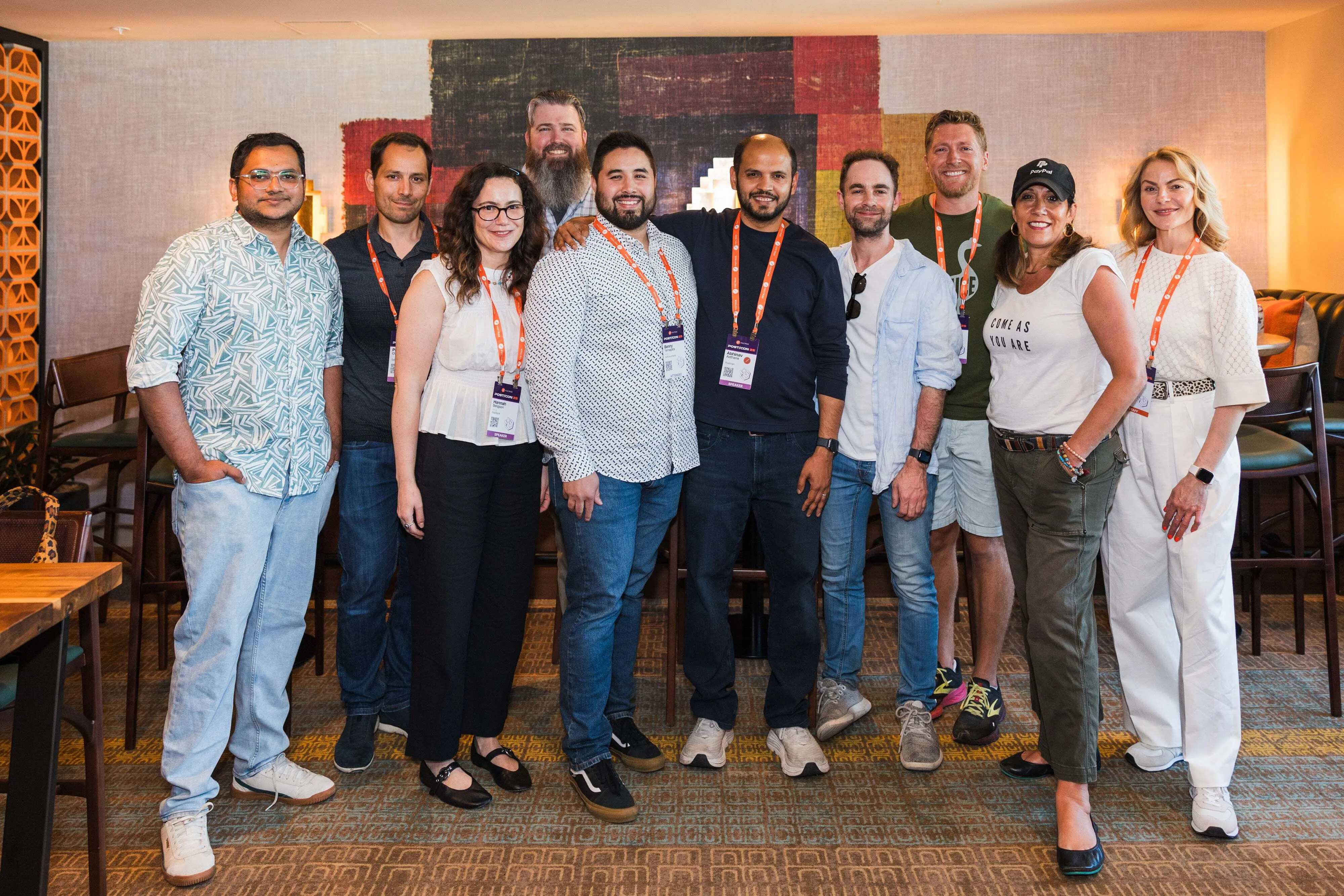 Group photo of Ojus Save (Zoom), Phillipe Ozil (Salesforce), Hannah Seligson (Hubspot), Robert Buchanan (P&G), Benny Yamagata (NetDocuments), Abhinav Asthana (Postman), Michael McGovern (Paddle), Allen Helton (Momento), Rebecca Hauck (PayPal), and Patrica Dugan (Postman).