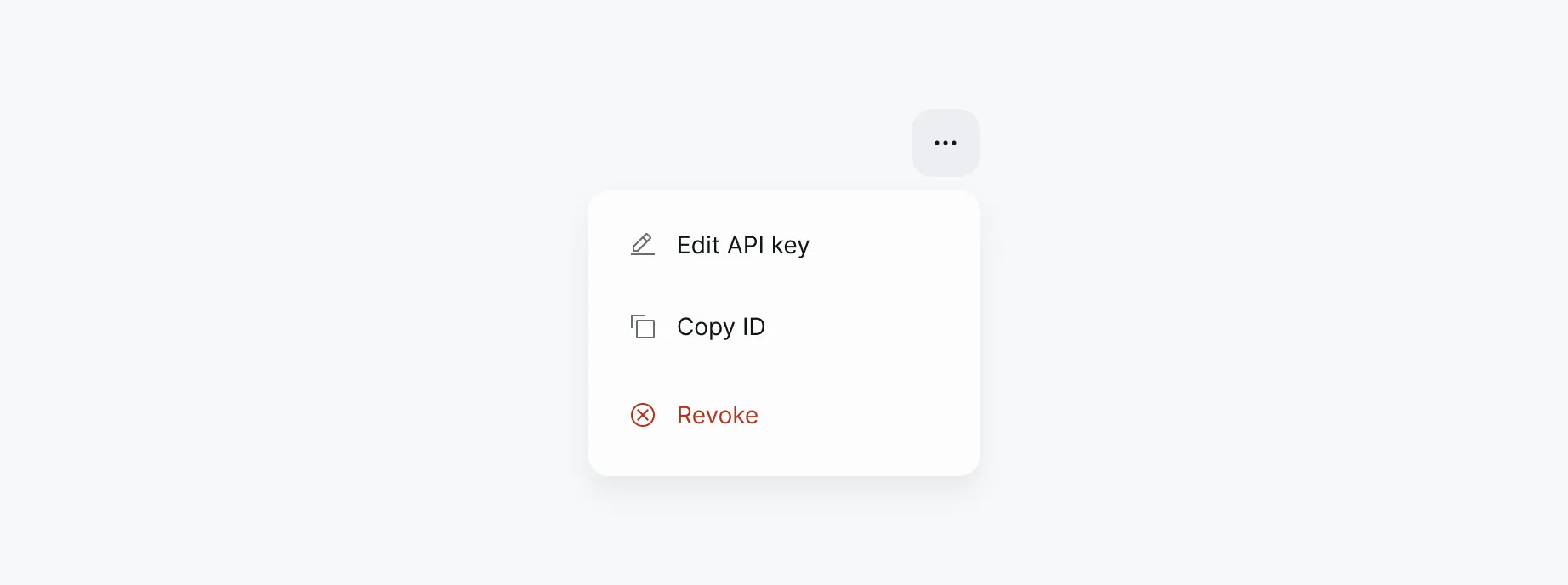 An open dropdown action menu triggered by a three-dot button, showing three options: Edit API key, Copy ID, and Revoke — the last in red to signal a destructive action.